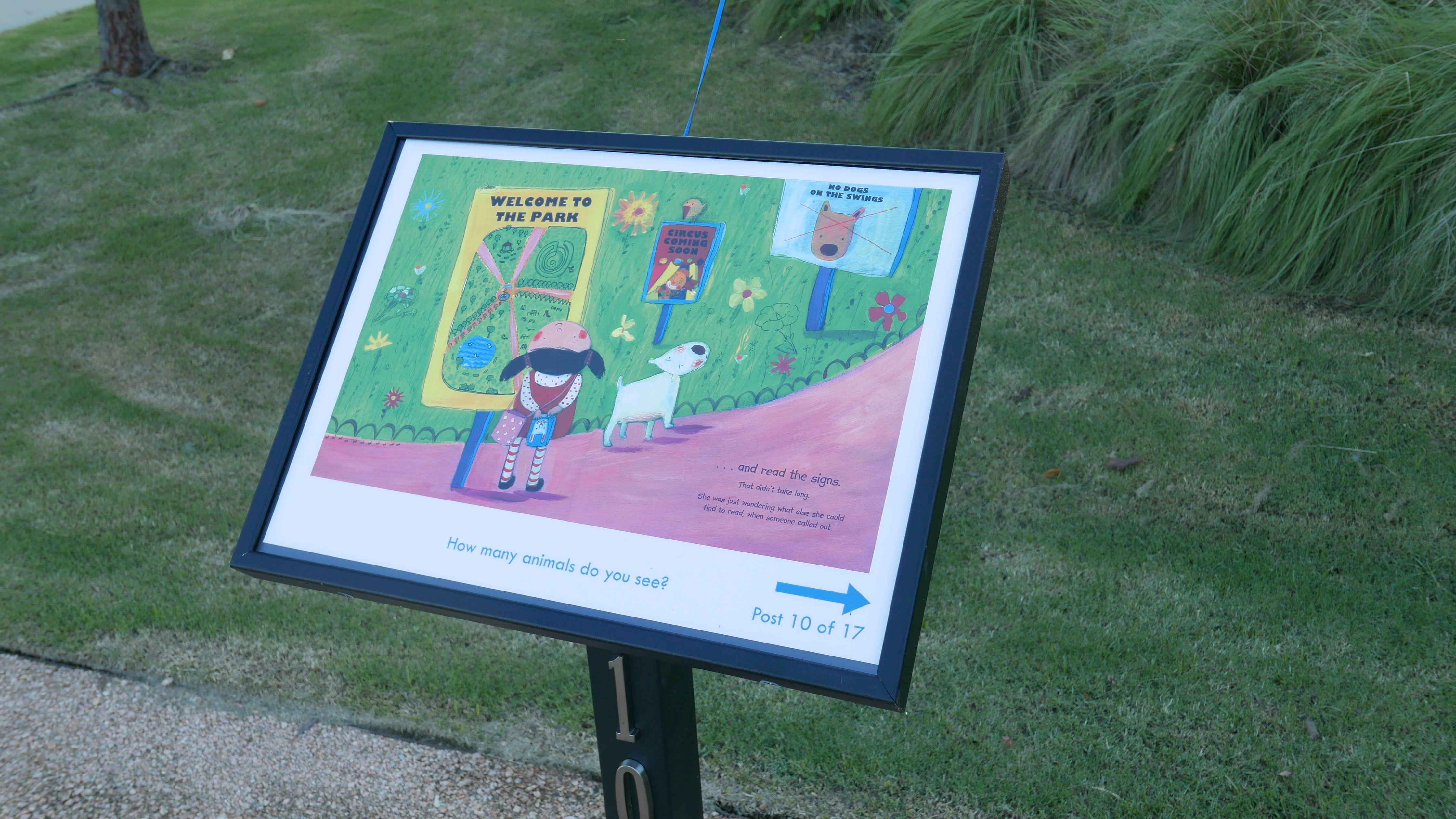 Storybook post in the park featuring a picture book. 