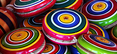 Close up of several colorful yo-yos.