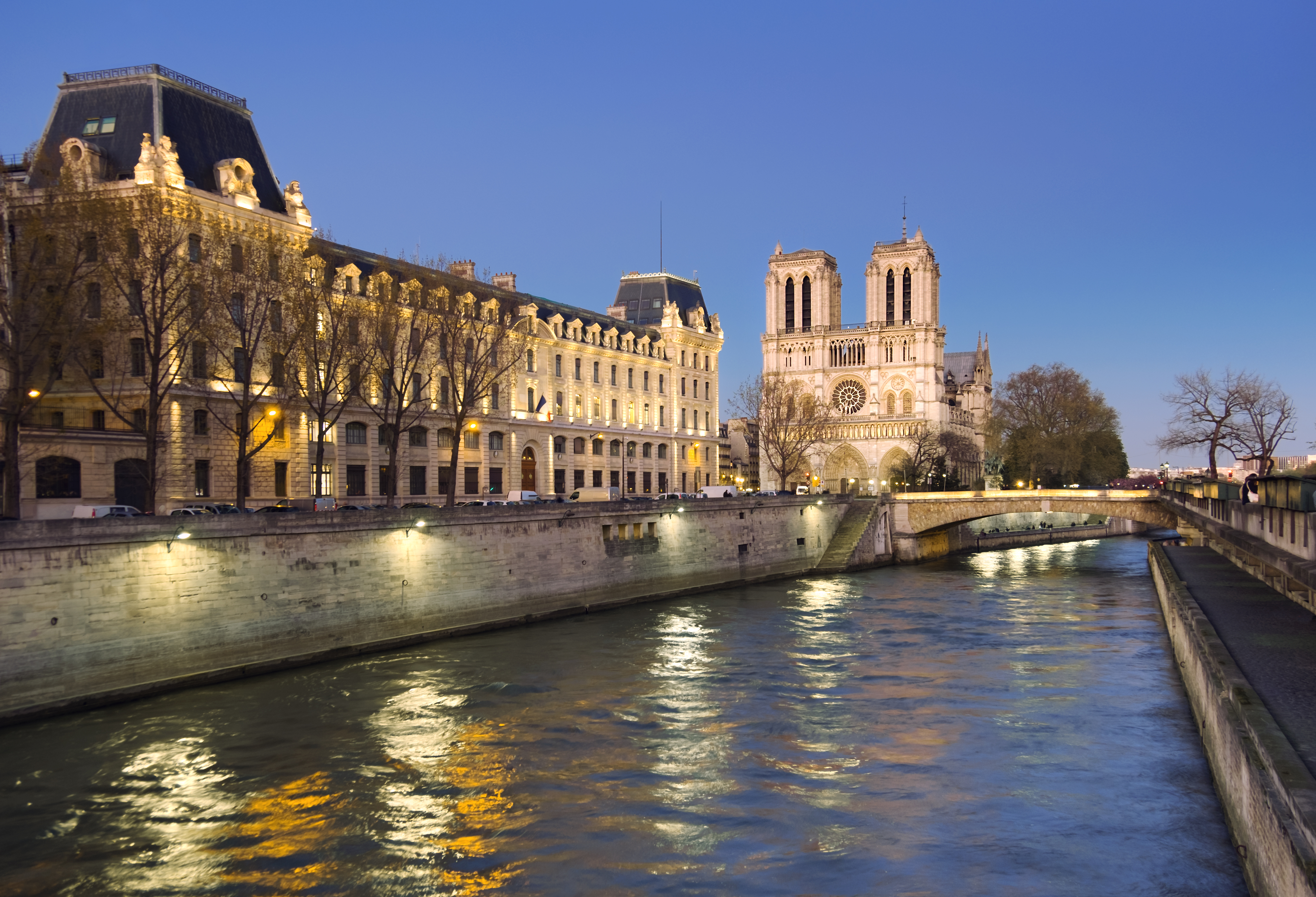 Seine river at night. Buildings along the shore.