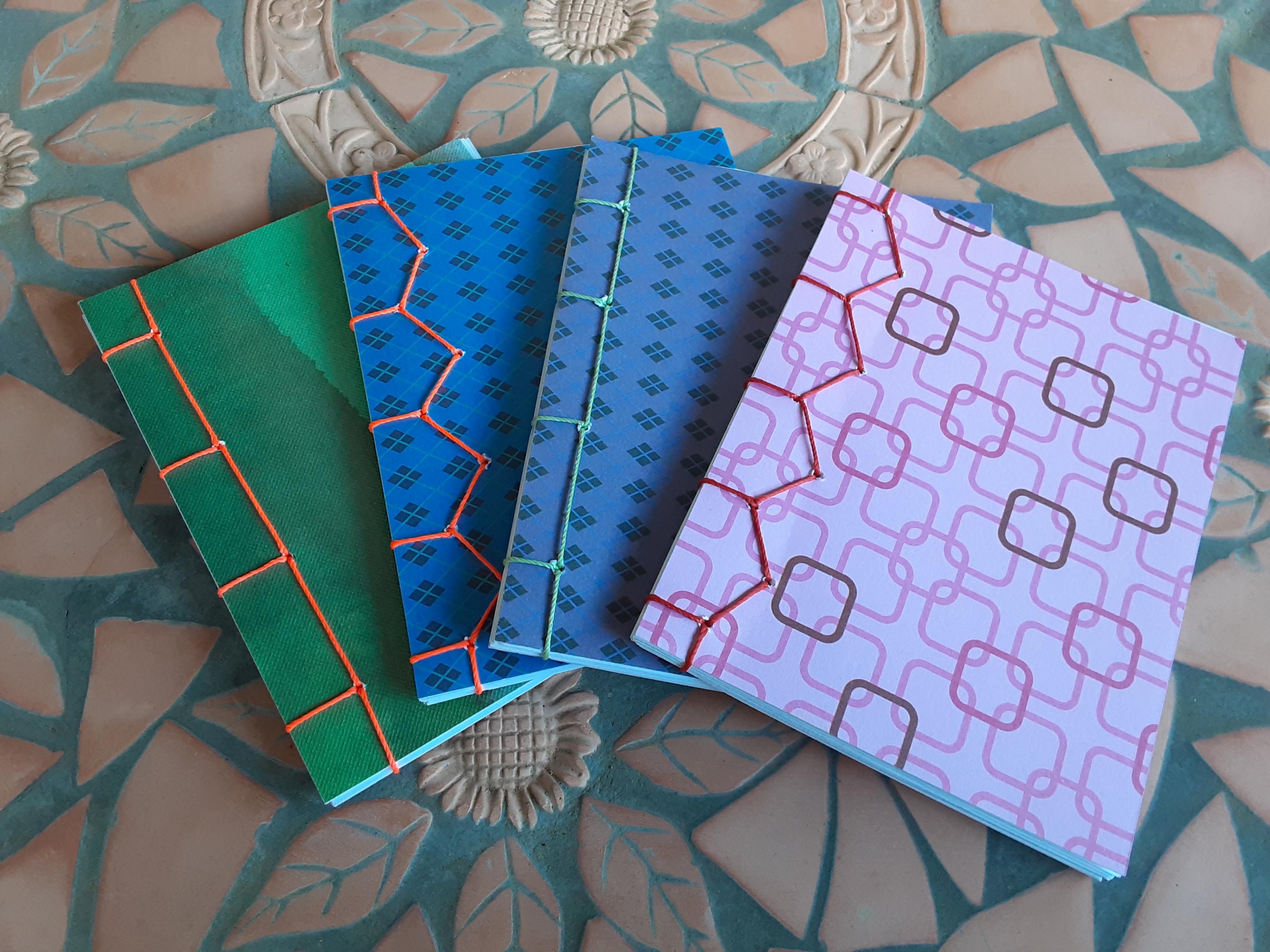 4 small notebooks bound using the Japanese stab-stitch technique.