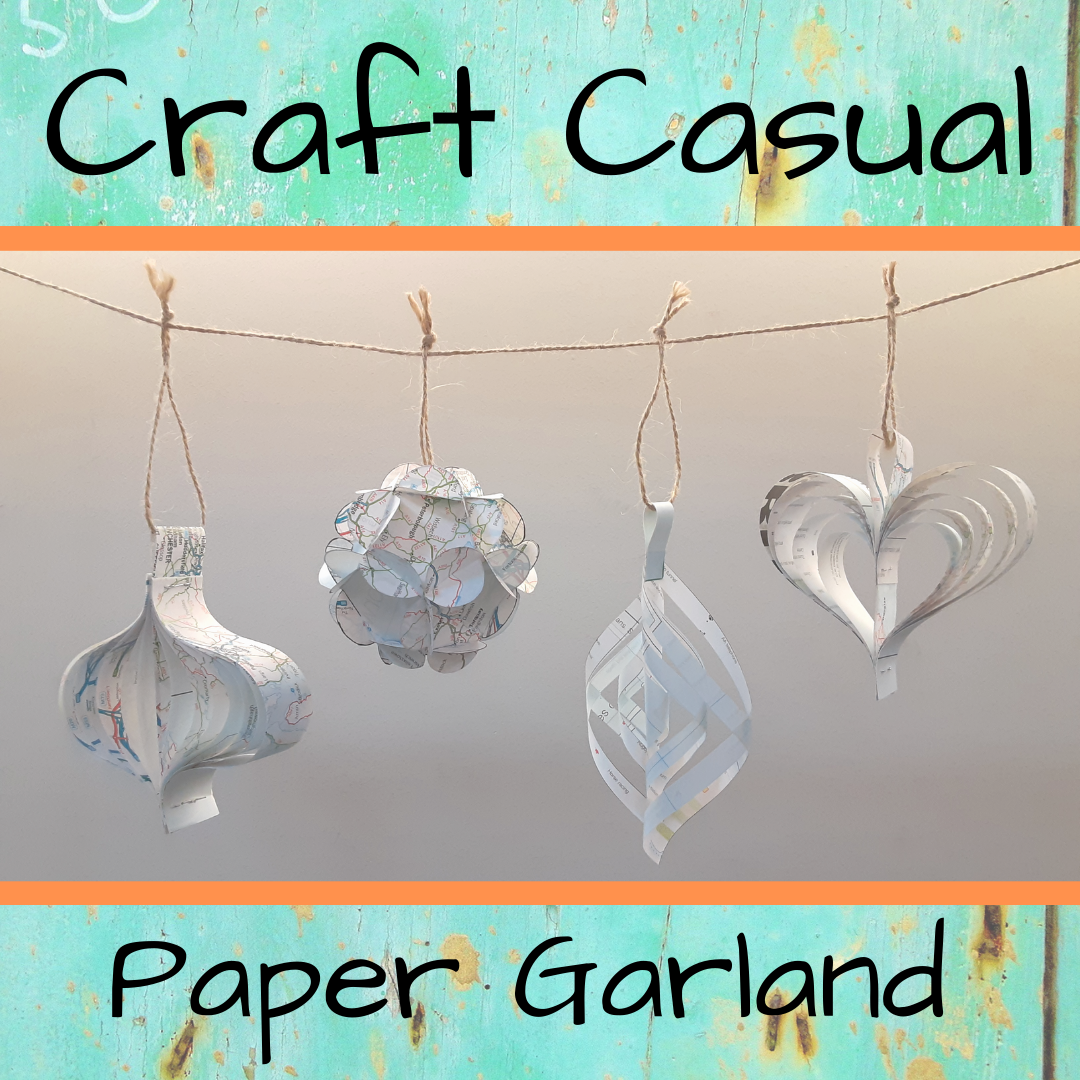 An image with a paper garland in the center.  The words "Craft Casual" are across the top and "Paper Garland" across the bottom.  The words are on a teal background.