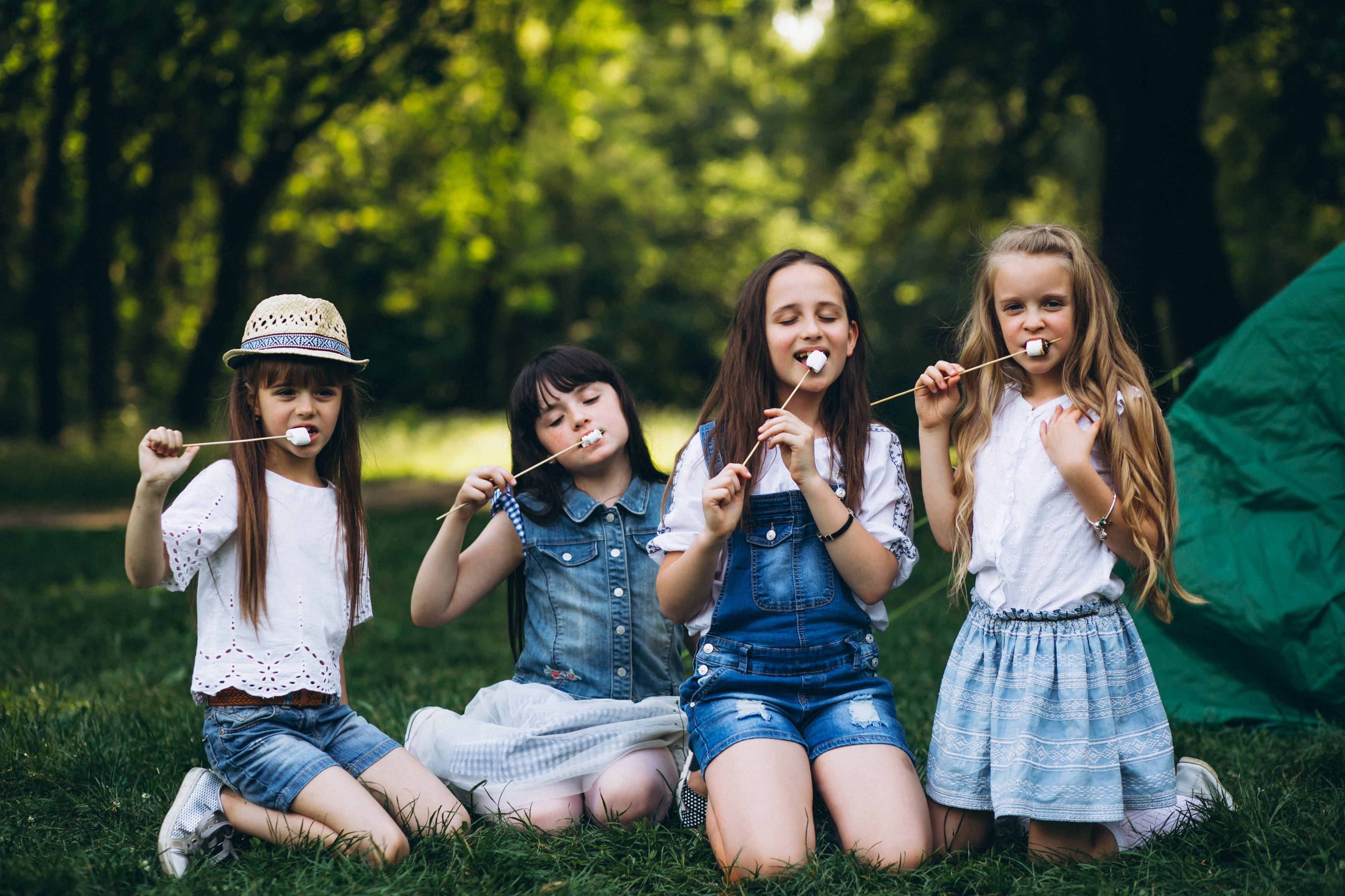 A group of young girls eating smores
