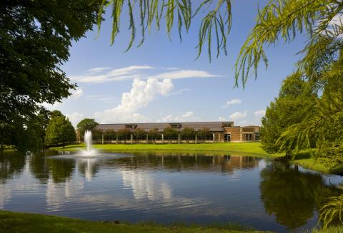 Cozby Library seen over pond with fountain