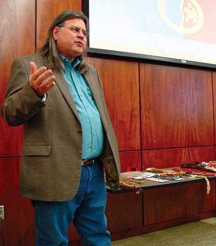 Photo of Lance Tahmahkera giving a lecture.