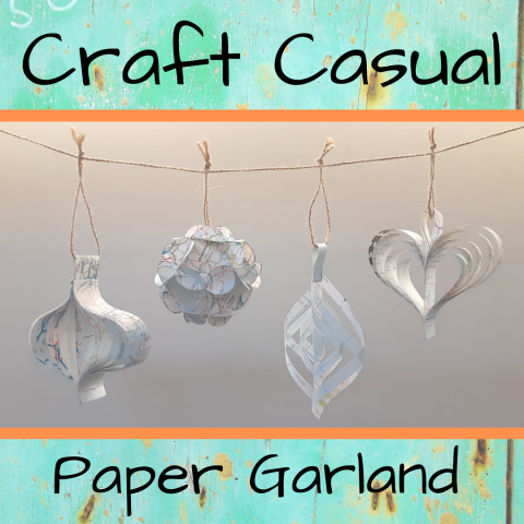 An image with a paper garland in the center.  The words "Craft Casual" are across the top and "Paper Garland" across the bottom.  The words are on a teal background.