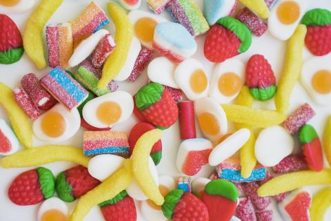 Various candy scattered on table.