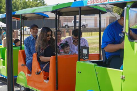 People riding on a trackless train.