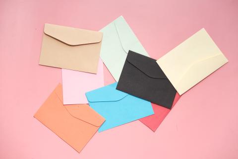 Envelopes on a pink background.