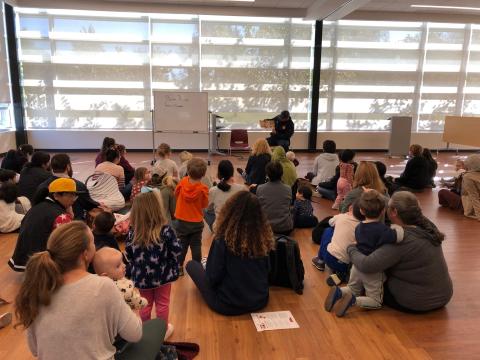 Firefighters reading stories to families.