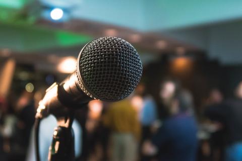 Microphone in front of a crowd.