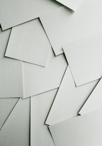 Scattered sheets of white paper.