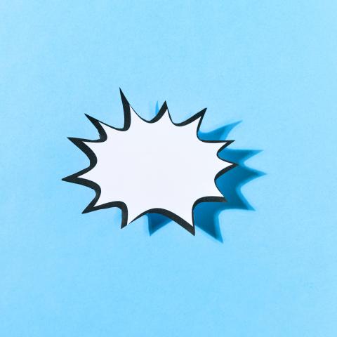 Paper starburst shape on a blue background.