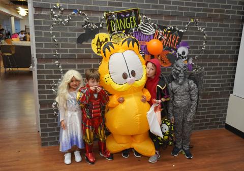 Kids in Halloween costumes.