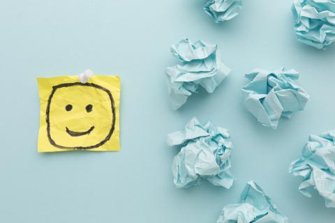 Yellow smiley face on blue table