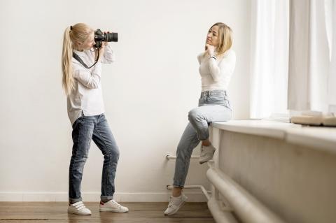 Photographer taking photo of a model