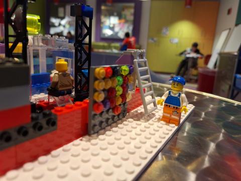 LEGO creation of a house and minifigures.