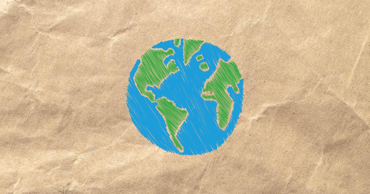 Brown paper with a hand drawn earth in the center.