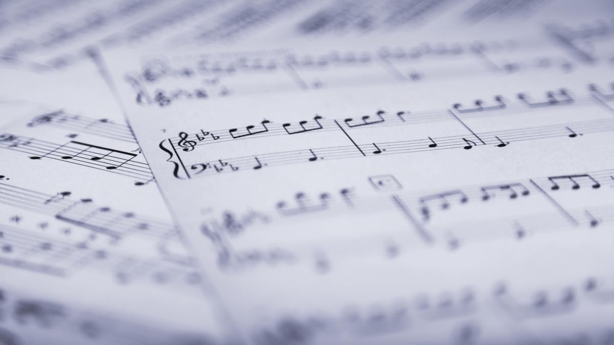 Close up of scattered sheet music.