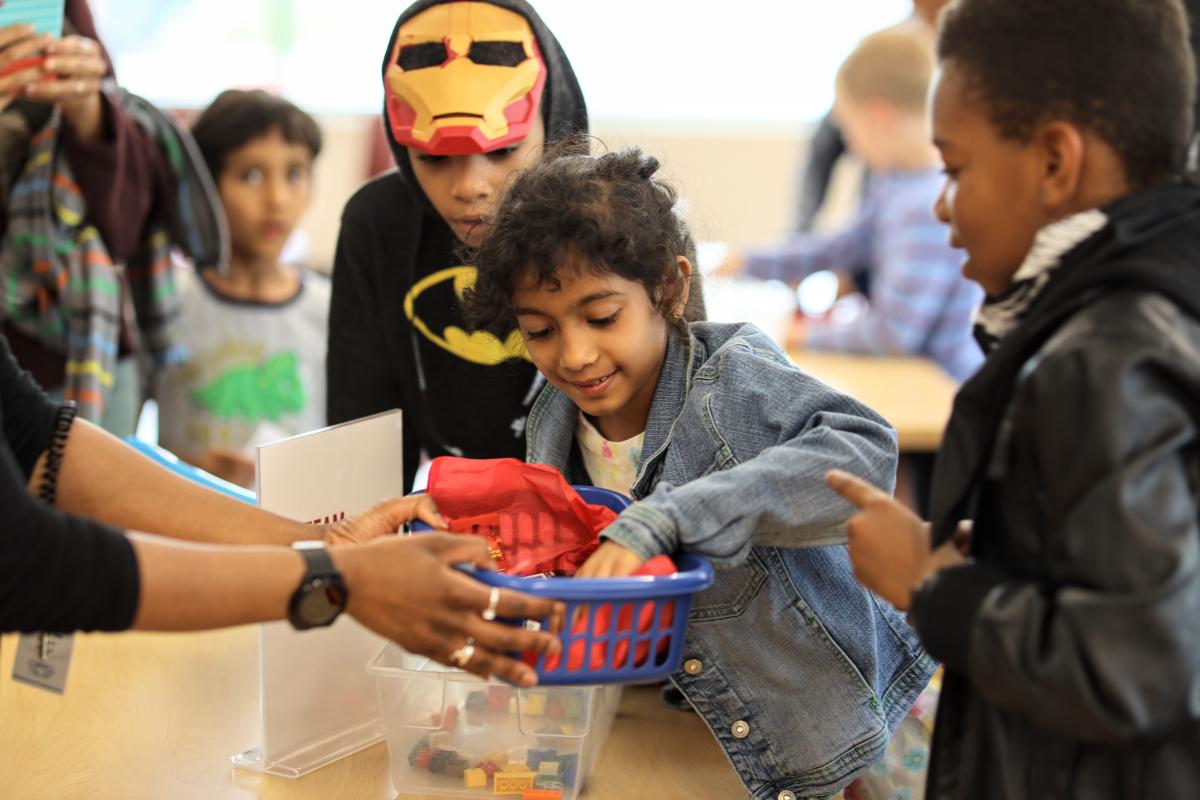 Kids looking through prizes at CozbyCon 2019.