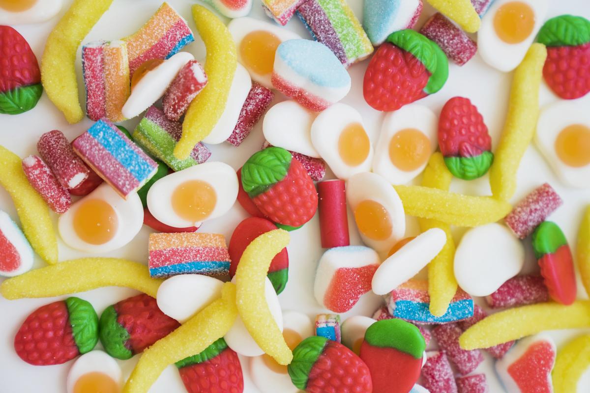 Various candy scattered on table.