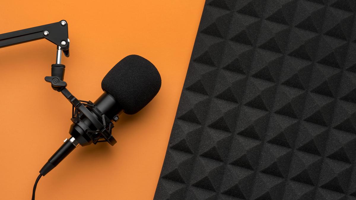 Microphone and insulation foam on an orange table