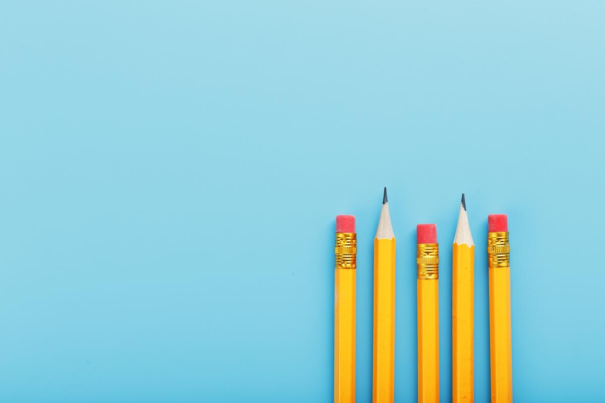 Sharpened pencils on a blue background.