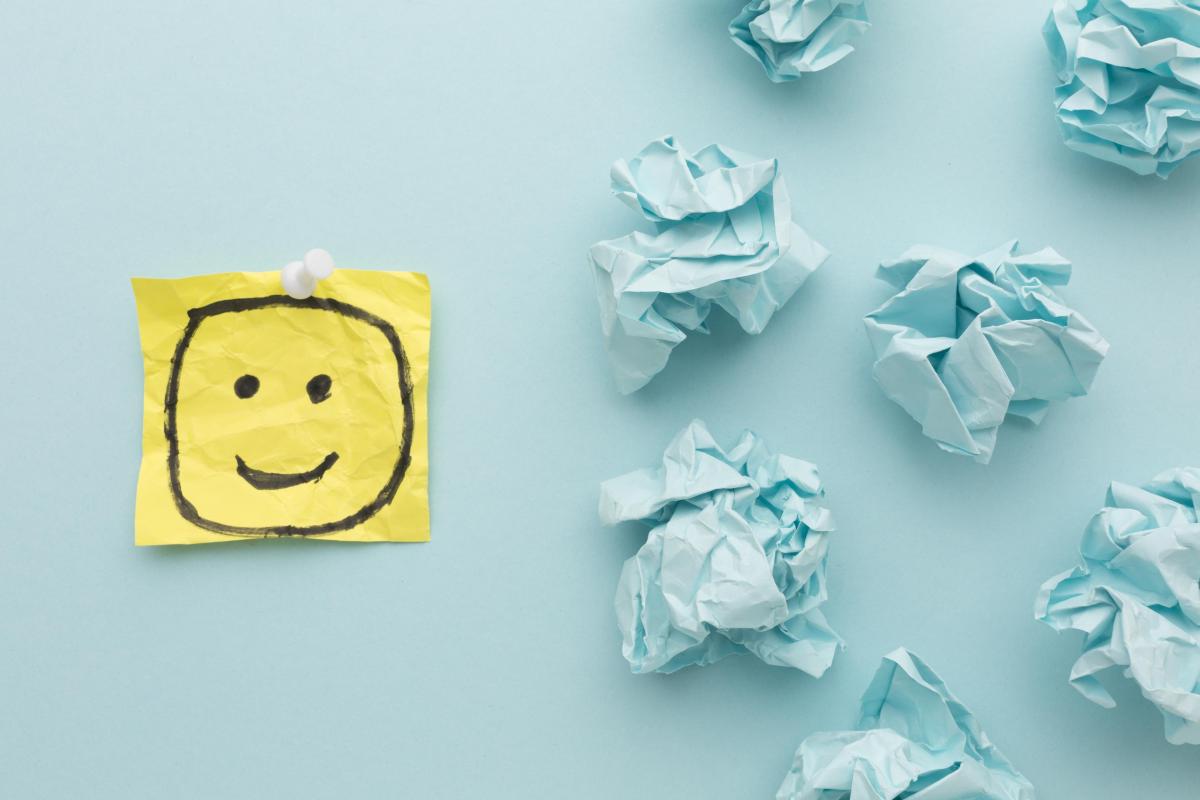 Yellow smiley face on blue table
