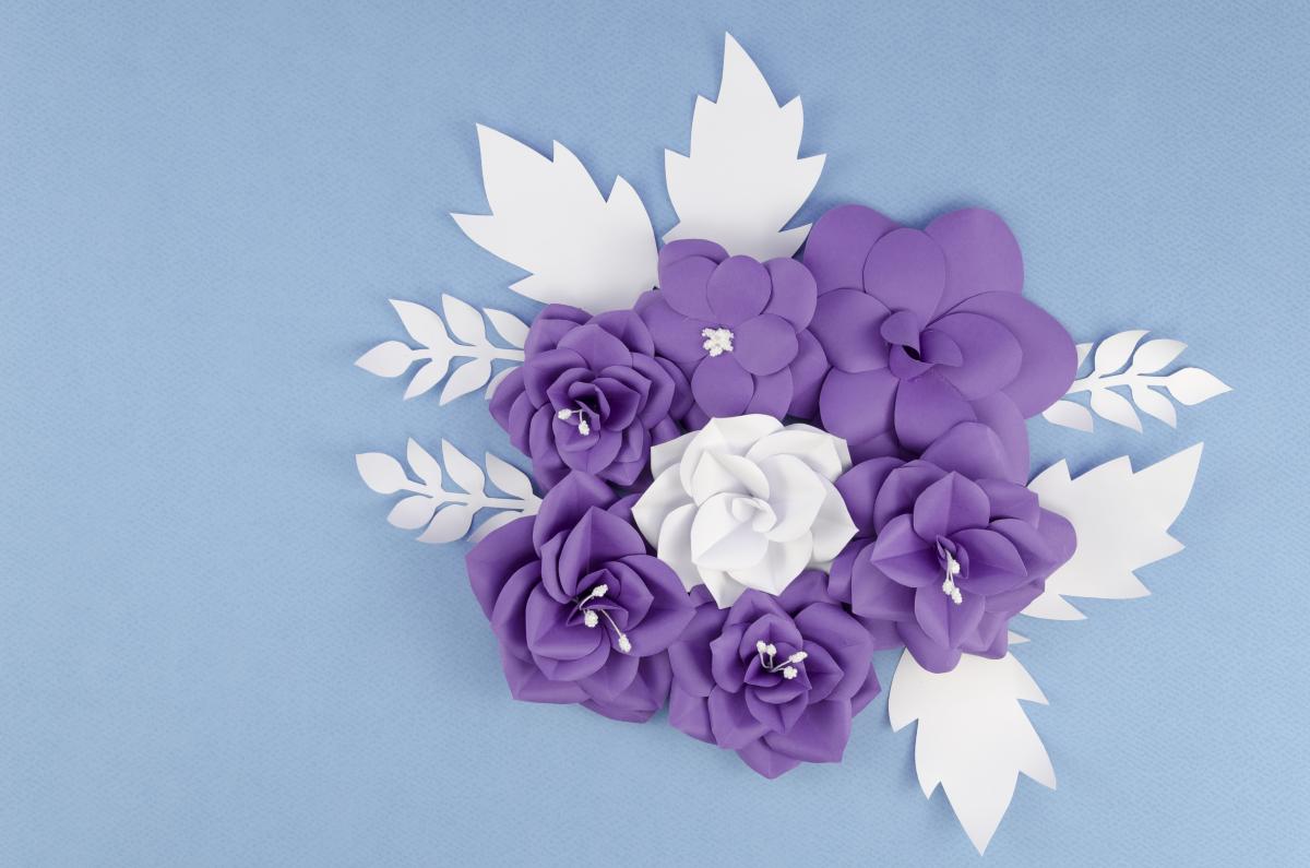 Blue paper flowers on a blue background